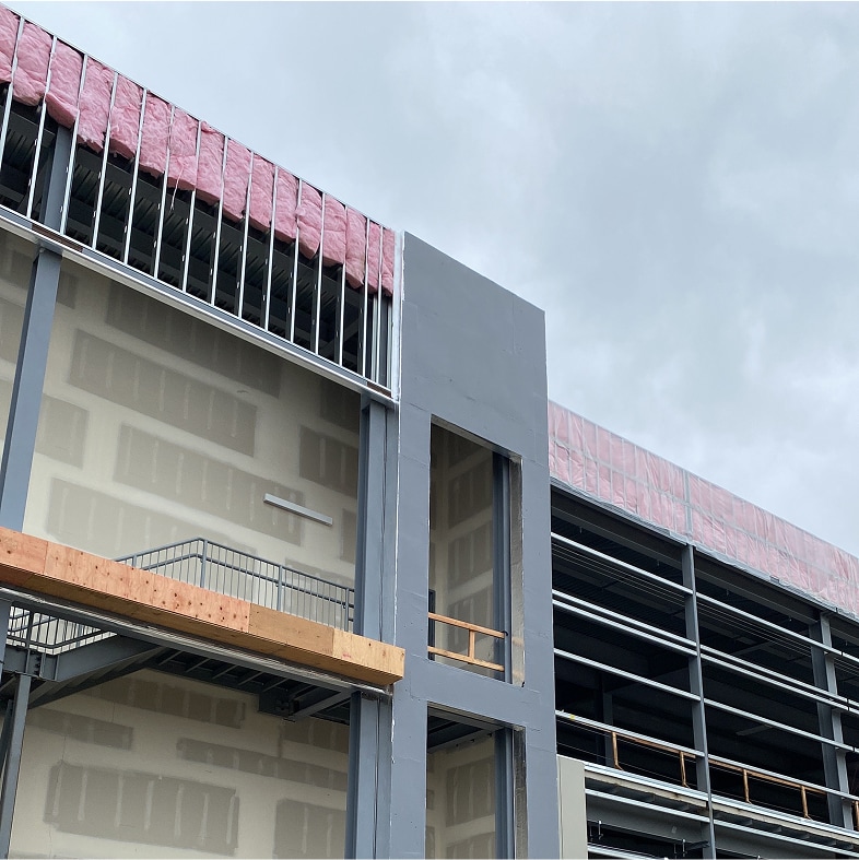 Exterior Wall System integrated with a roofing system.