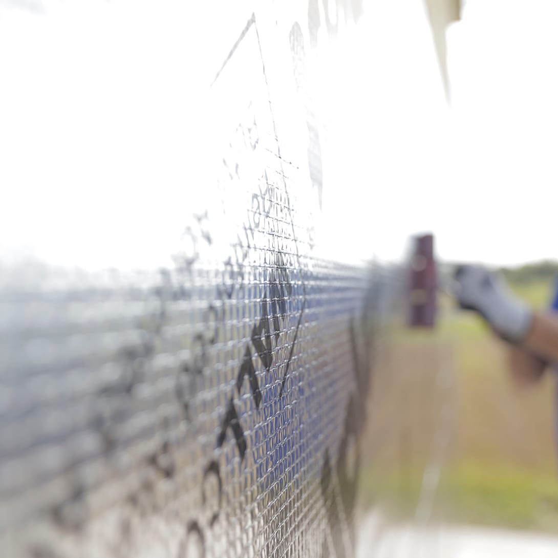 Installation of WALLcontrol air and water-resistive barrier on a wall.