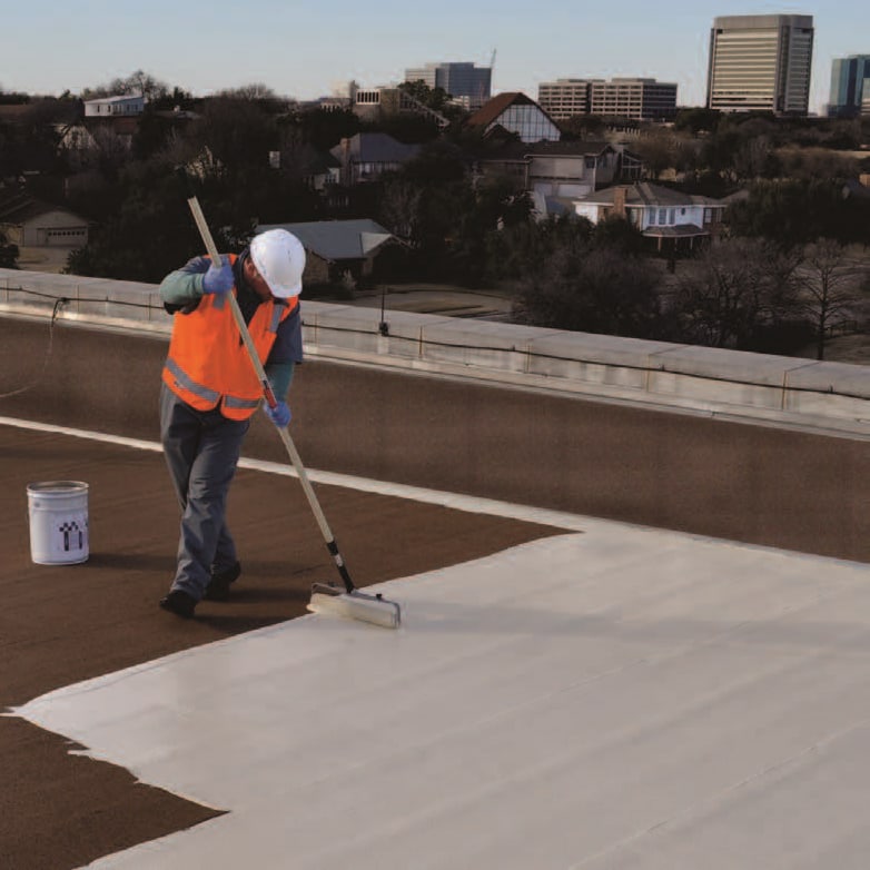 contractor applying Paracoat Roof Coating