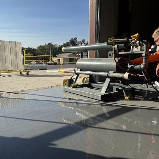 Roof application equipment on a gray paver system, illustrating enhanced impact protection for longevity and structural integrity.