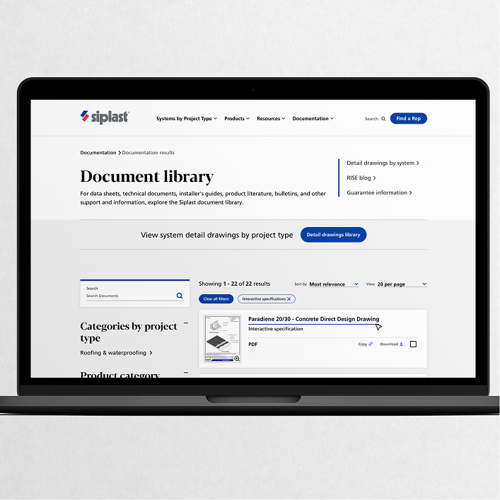 A laptop screen displaying an interactive roofing specification document with a technical cross-section diagram of a flashing assembly and a product selection dropdown menu.