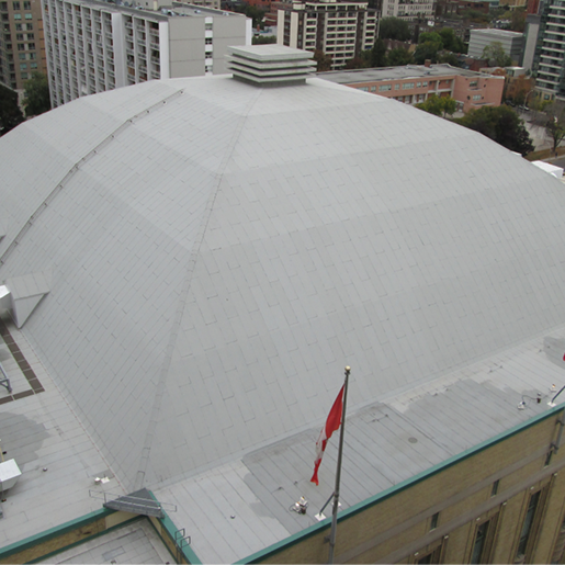 The large, white dome roof of Maple Leaf Gardens, illustrating techniques for waterproofing a roof in cold weather.