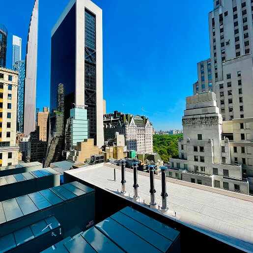 City skyline view from a commercial roof highlighting SBS guide specifications resources.