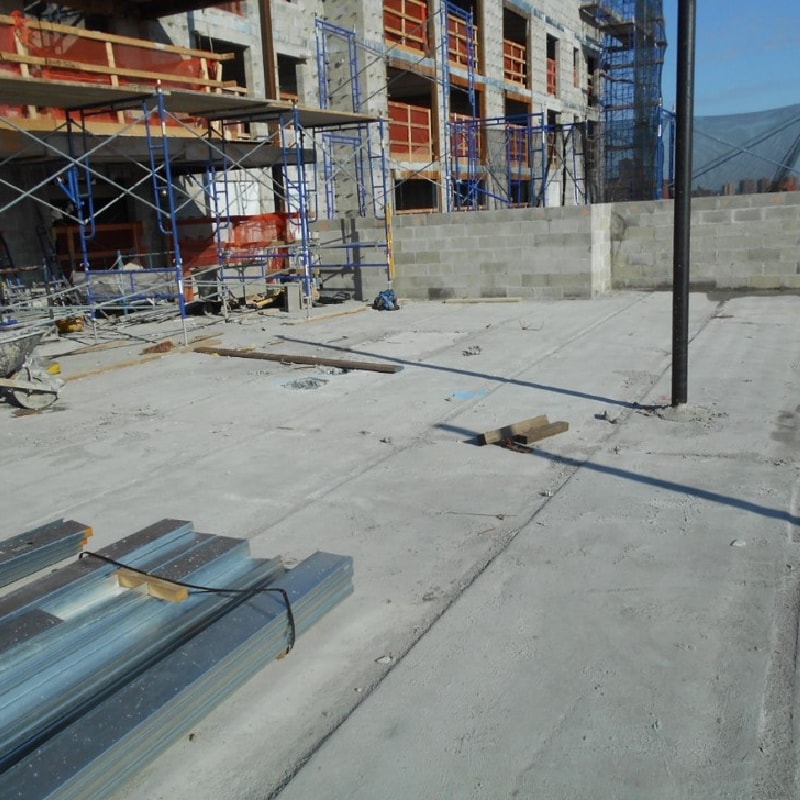 A concrete roof deck on a construction site, illustrating a webinar course on Substrates and Roof Membrane Foundations.