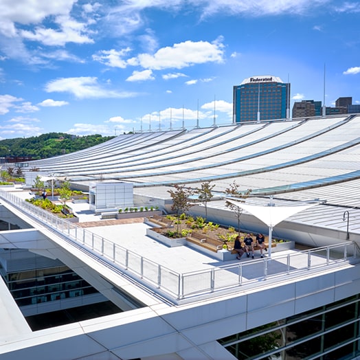 Fully compatible green roof systems on a modern building with shade structures