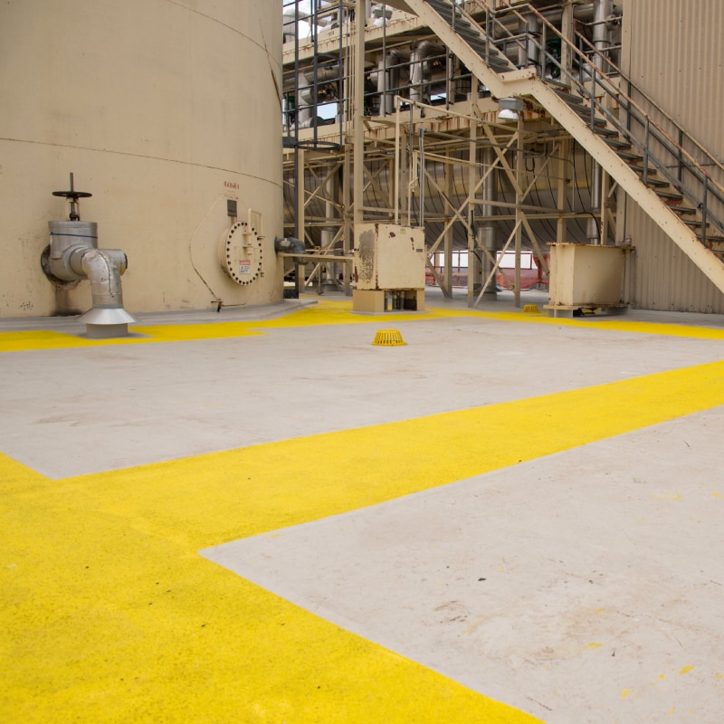 Siplast PMMA materials for roofing used on a yellow roof walkway