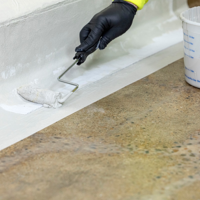 Contractor installing PMMA as waterproofing membrane