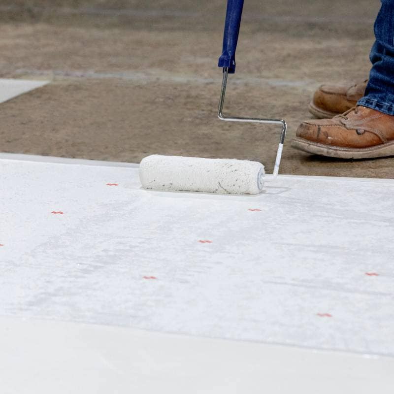 Contractor installing Pro Fleece with roller