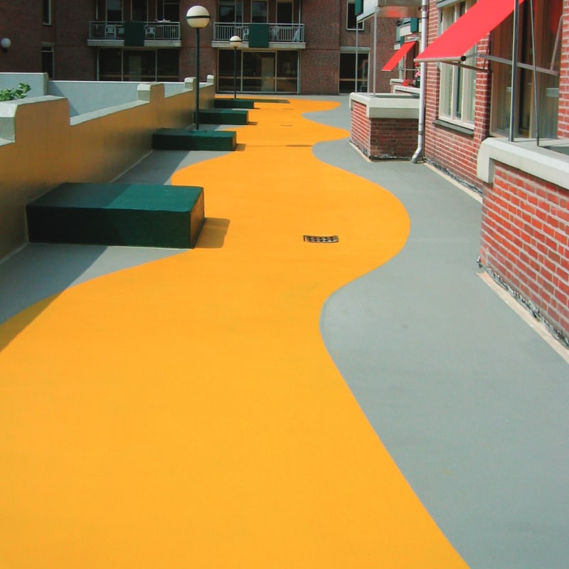 Article thumbnail featuring a yellow and gray plaza deck, highlighting PMMA applications for high-traffic waterproofing.
