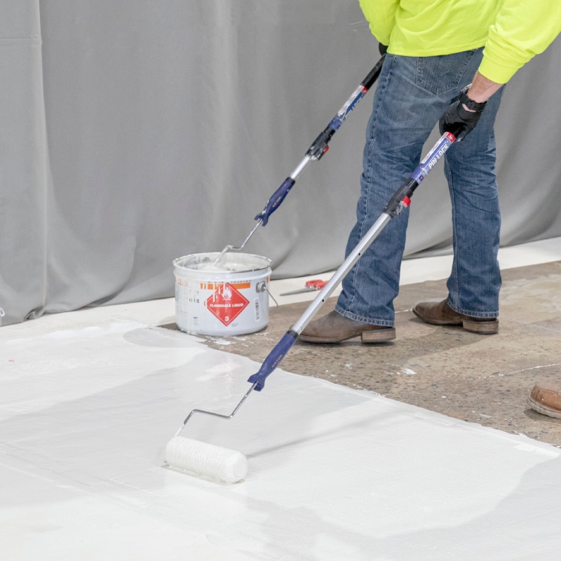 Contractor installing a durable PMMA waterproofing system using Siplast materials