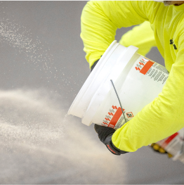 Contractor taking Siplast Terapro Waterproofing materials from bucket