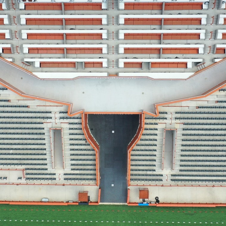 An empty football stadium is shown highlighting a Siplast waterproofing system on the stadium's deck and walkway.