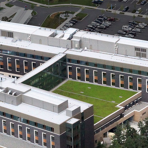 Aerial view of a modern building with a high-performance SBS-modified bitumen roof system.