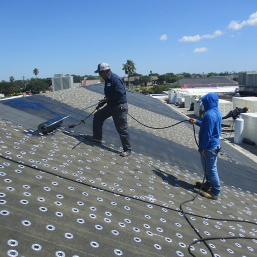 Roofing crew installing SBS membrane, representing access to safety data sheets and docs.