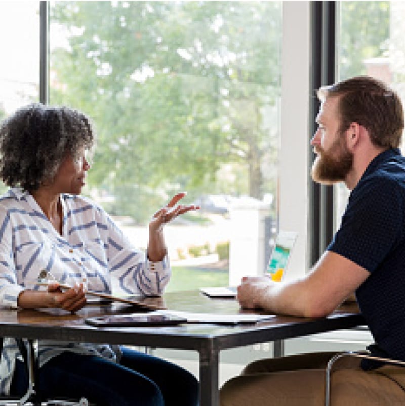 Financial counselor working with employee on plan