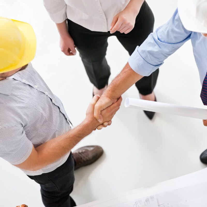 Siplast employees shaking hands with architects