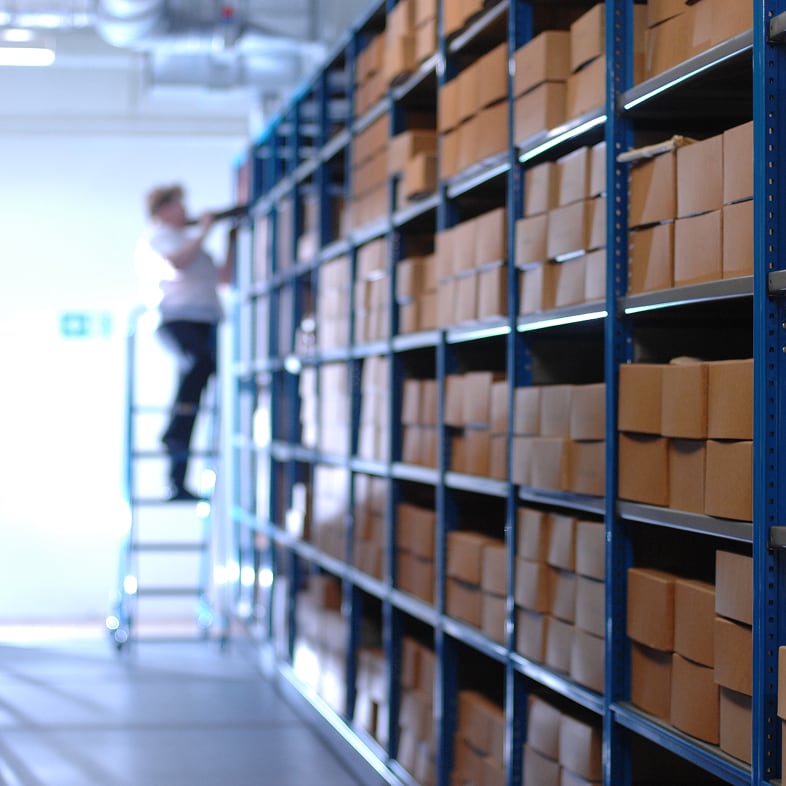 A storage vault, an interior space protected by below-grade waterproofing.