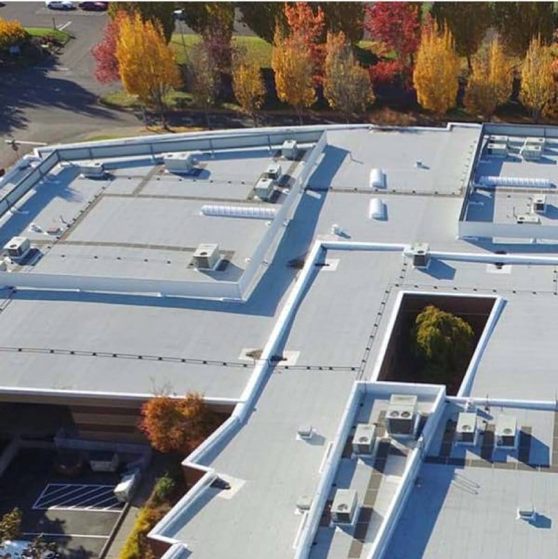 Aerial view of commercial roof with SBS and PMMA products