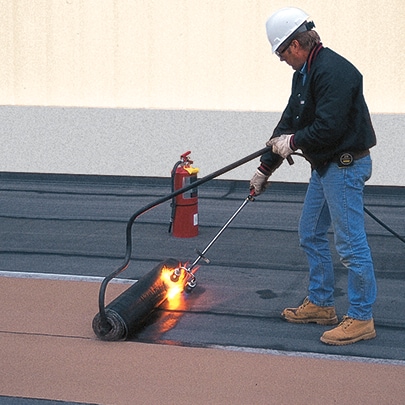 Roofing contractor installing Paradiene SBS-Modified Bitumen products