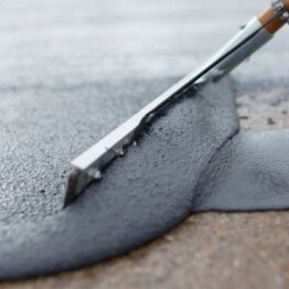 Applying Terapo concrete protection materials with construction tool
