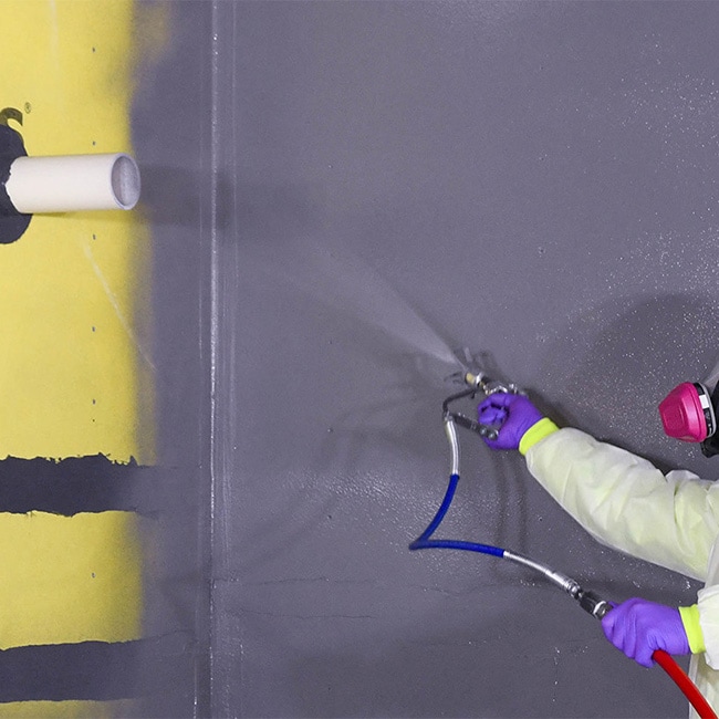 Contractor installing commercial air and water barrier