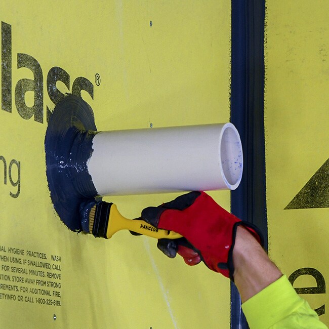 Contractor installing commercial air and water barrier