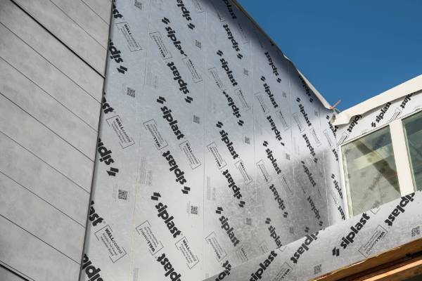 Siplast WALLcontrol above-grade wall system installed on a building exterior.