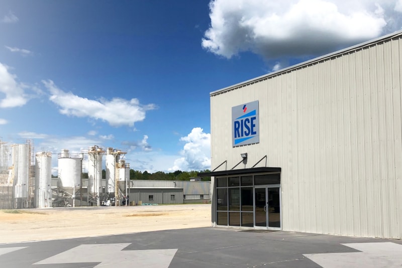 Exterior of a RISE Center laboratory, showing surrounding manufacturing facilities and clear ground.