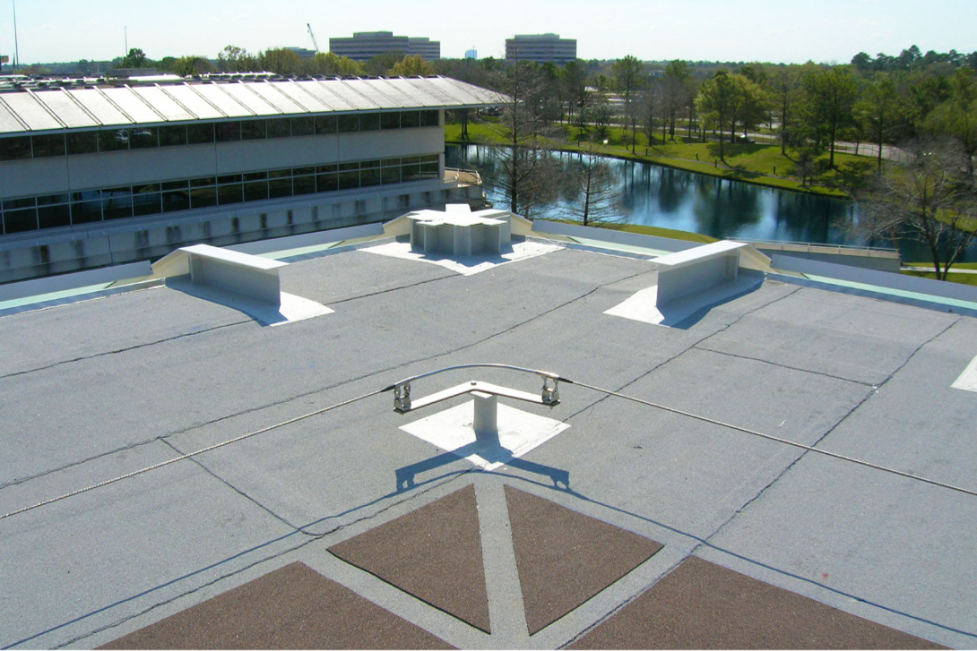 Commercial roof showing Siplast Parapro Flashing on complex penetrations and beams.