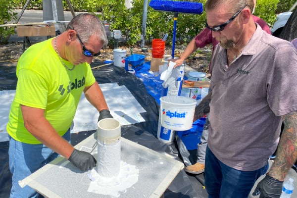 Siplast employee providing guidance on installing materials