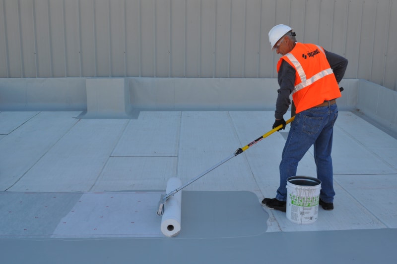 Man installing Parapro Roof Membrane resin by Siplast