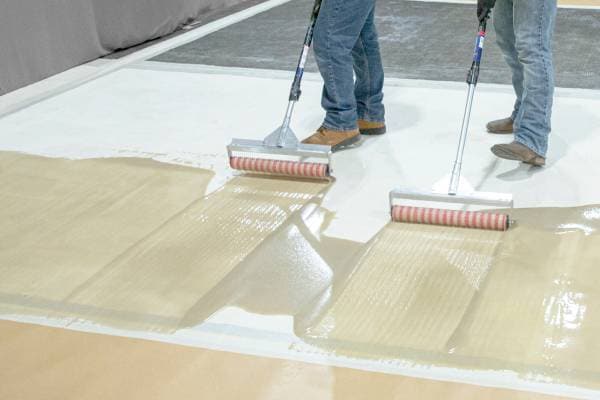 Men using rollers to apply Terapro VTS Resin