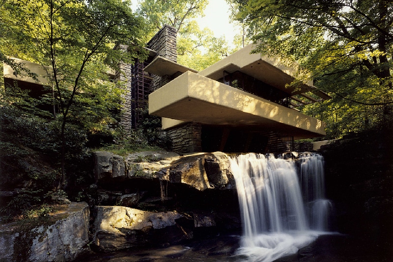 View of Fallingwater from the southwest prominently featuring the waterfall.