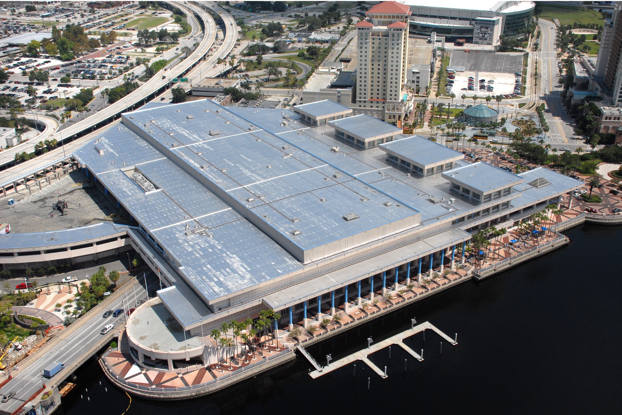 Aerial view of a large commercial building with an extensive Siplast SBS-modified bitumen roof system, illustrating Siplast's commitment to superior roof performance and quality.