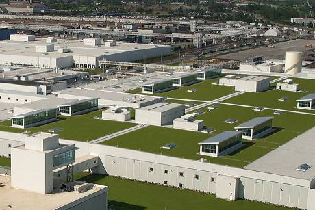 Aerial view of a large commercial facility roof featuring Siplast SBS-modified bitumen roof systems.