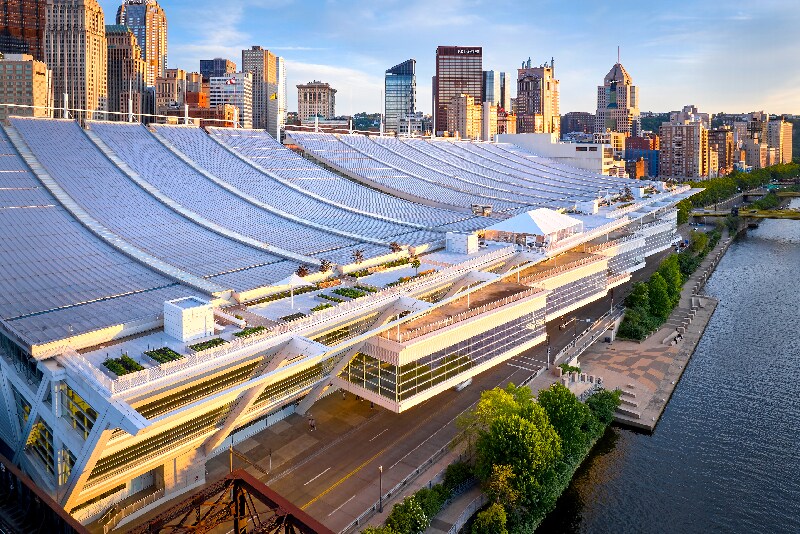 Rooftop amenity space at the David L. Lawrence Convention Center, featuring curved architecture, pathways, and integrated green planters.