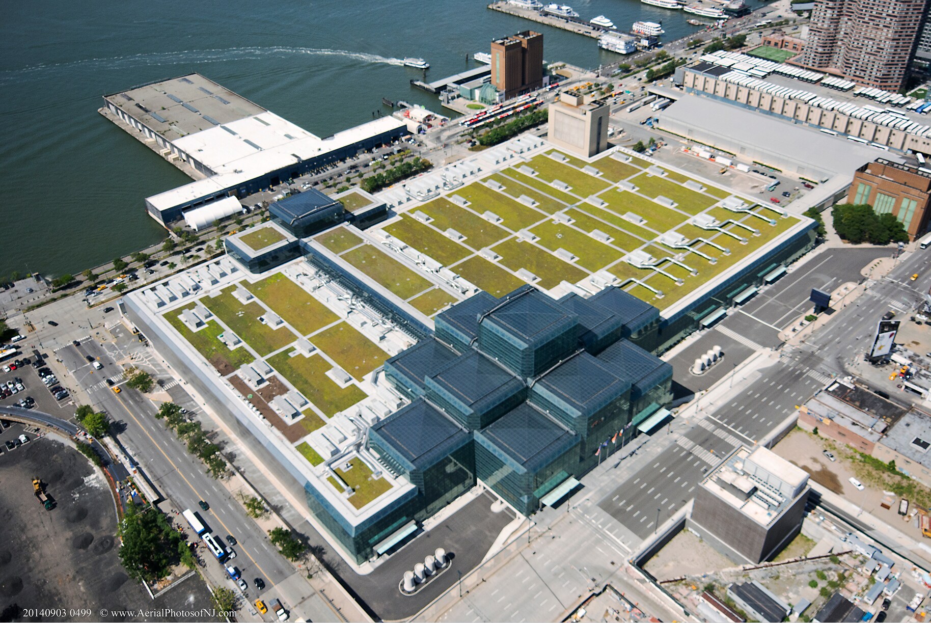 Aerial view of a commercial green roof with rooftop garden and walking paths