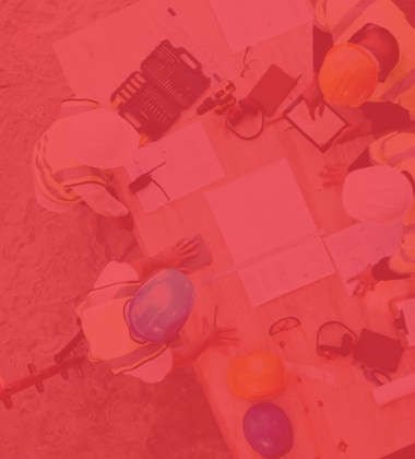 Abstract red overlay of people at a table, symbolizing collaboration and career opportunities at Siplast.