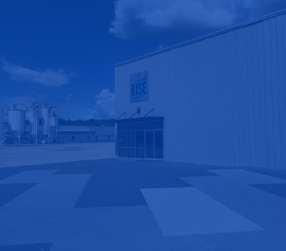 Exterior of the Siplast RISE Center building and manufacturing plant on a sunny day, showcasing the commitment to innovation.