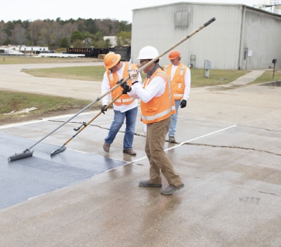 Siplast employees rolling out materials