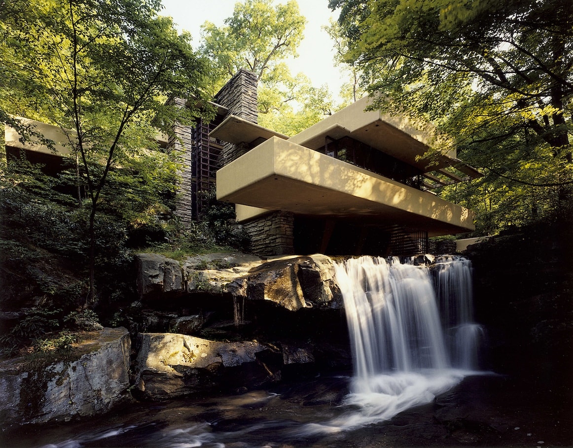 View of Fallingwater from the southwest prominently featuring the waterfall.