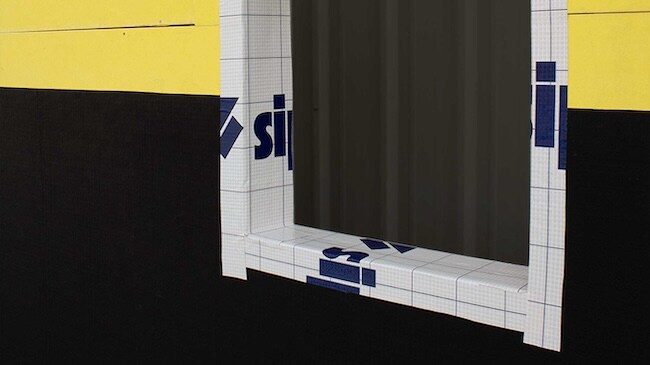 Detail of a window rough opening flashed with Siplast self-adhered membrane for water protection.