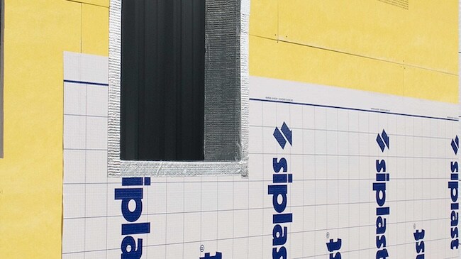Siplast air barrier membrane installed around a window opening on DensGlass sheathing.