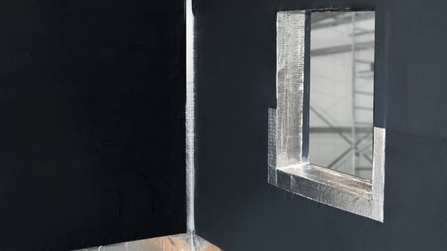 WALLcontrol Monolith VP Adhered AWB with flashing in a corner and window
