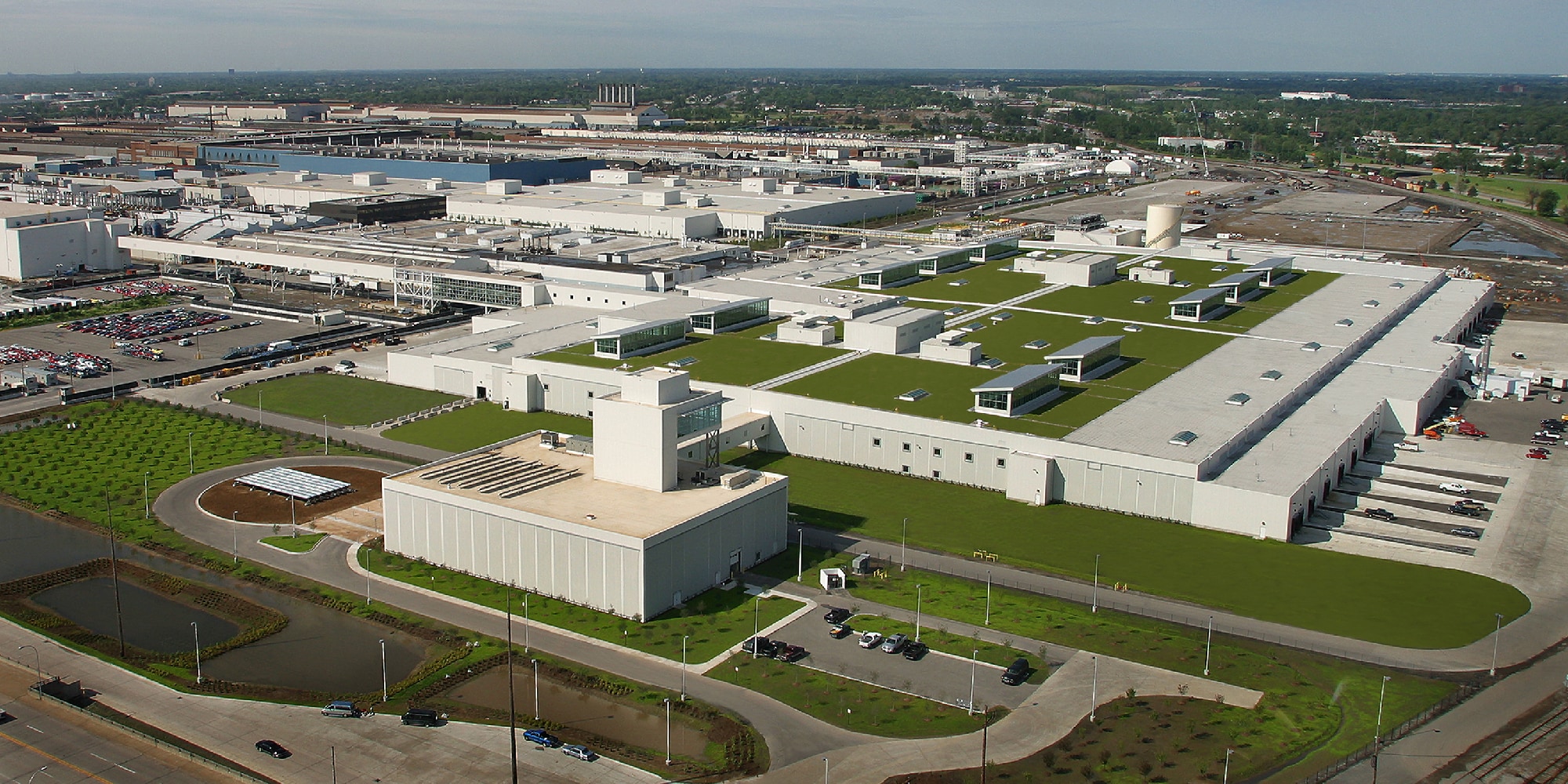 Aerial view of a large industrial facility featuring a sustainable SBS-modified bitumen roof system.