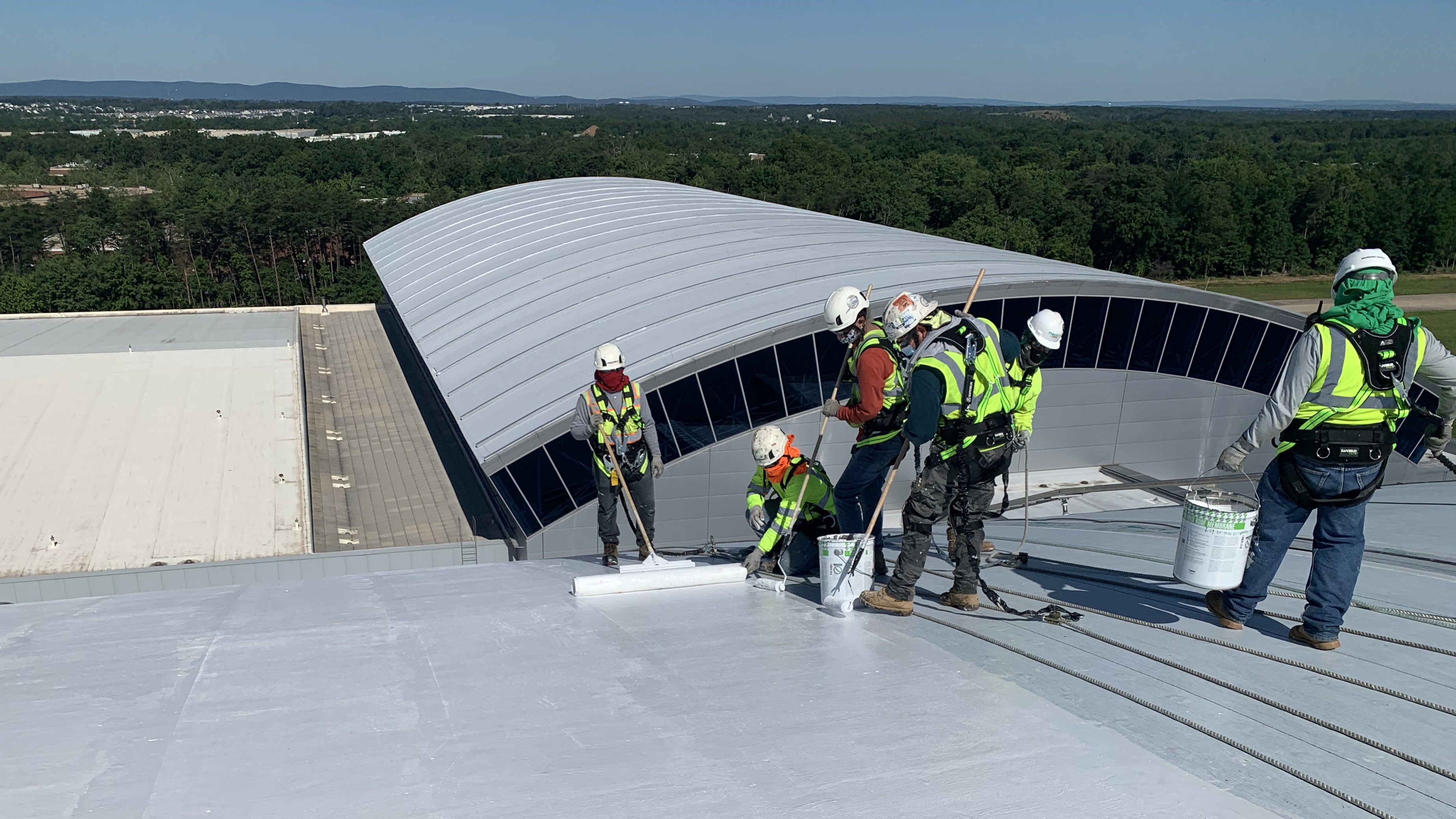 Contractors installing Siplast roofing materials