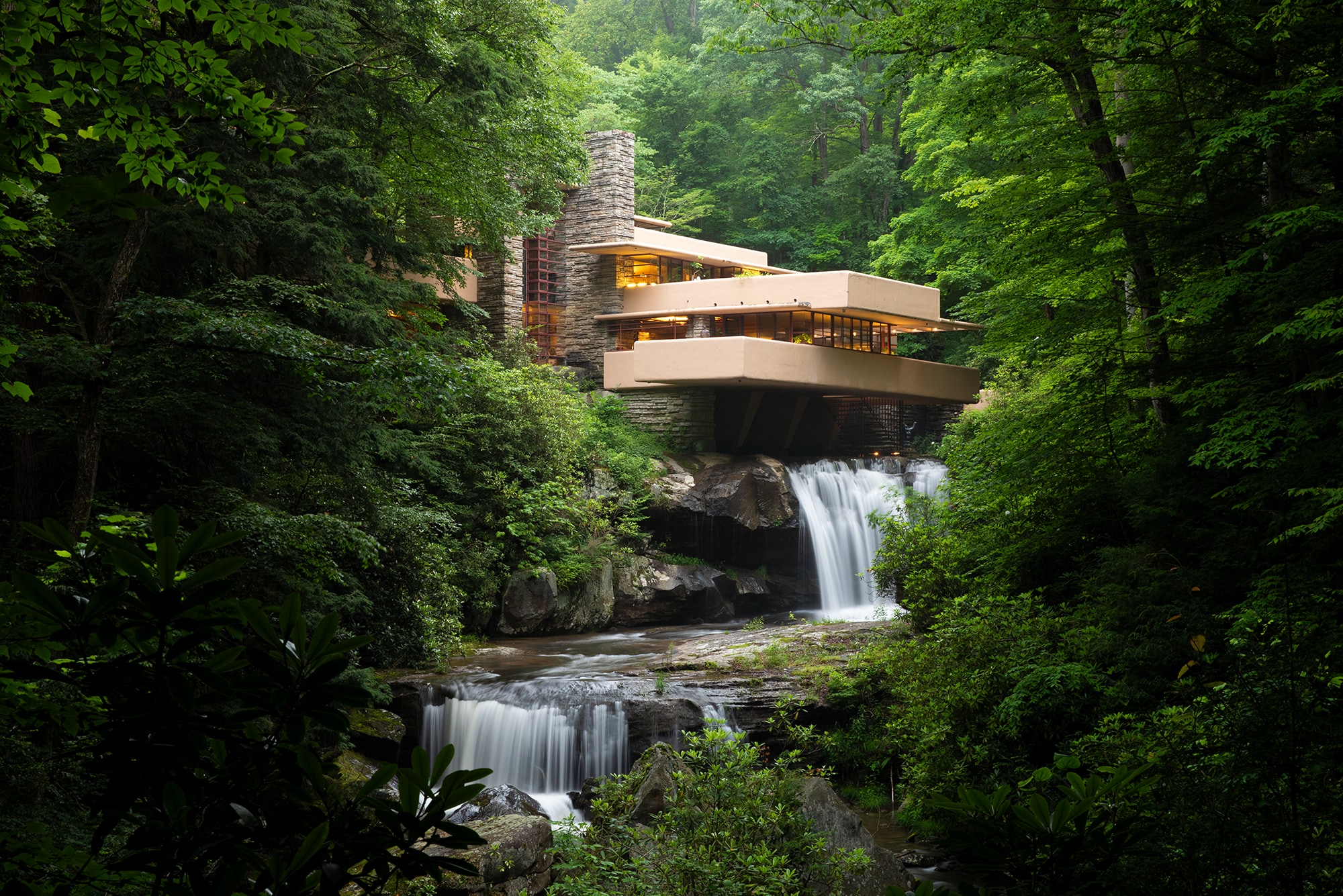 Exterior of Frank Lloyd Wright’s Fallingwater house cantilevered over a waterfall, protected by Siplast historic restoration waterproofing.