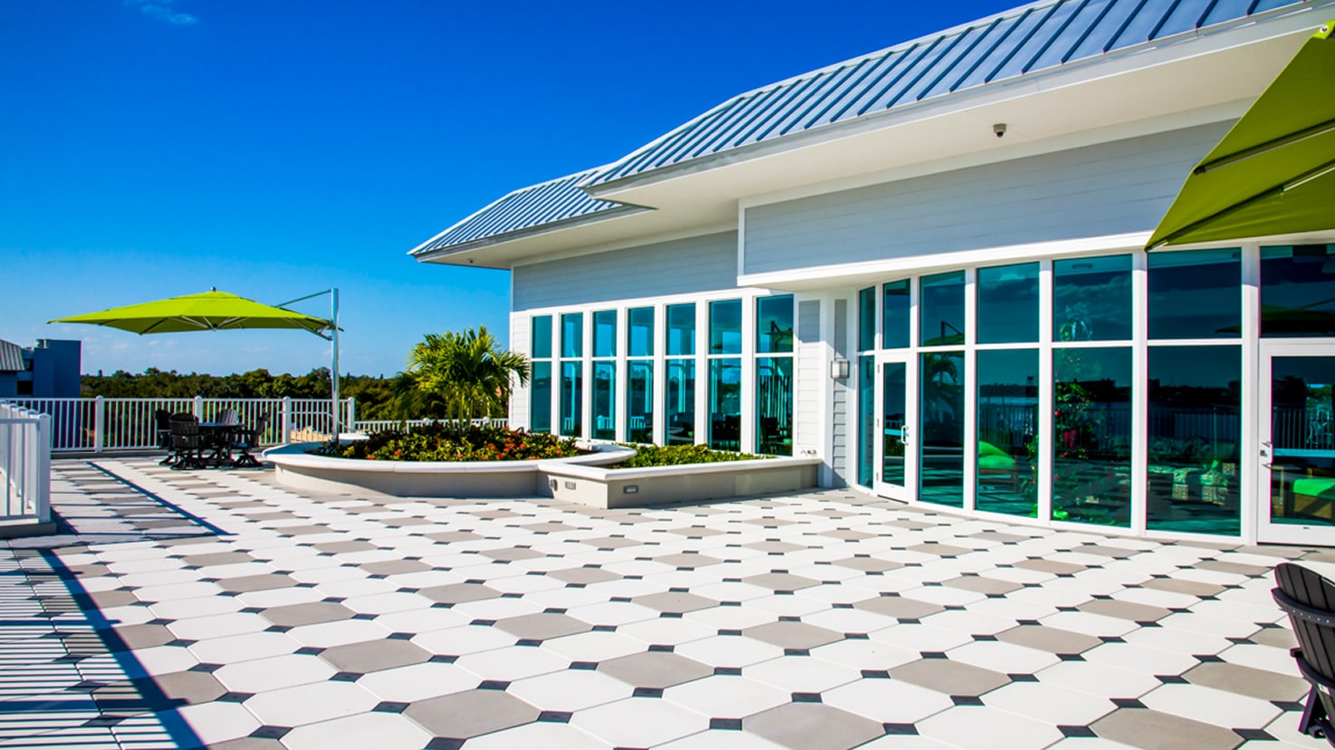 Outdoor rooftop area with pavers and building facade, showcasing design flexibility