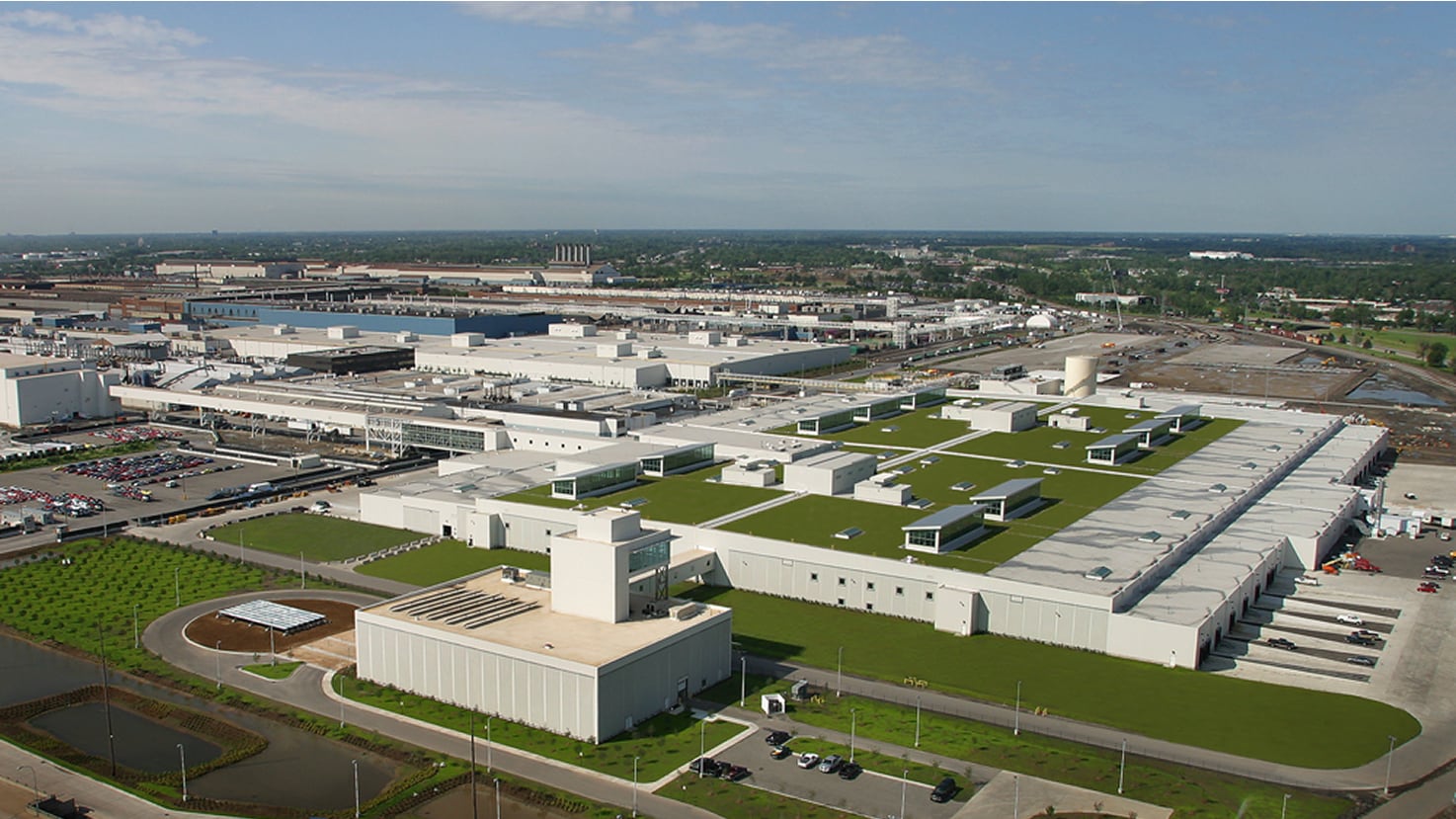 Industrial facility with green roofs, aerial view showing large-scale sustainable building design
