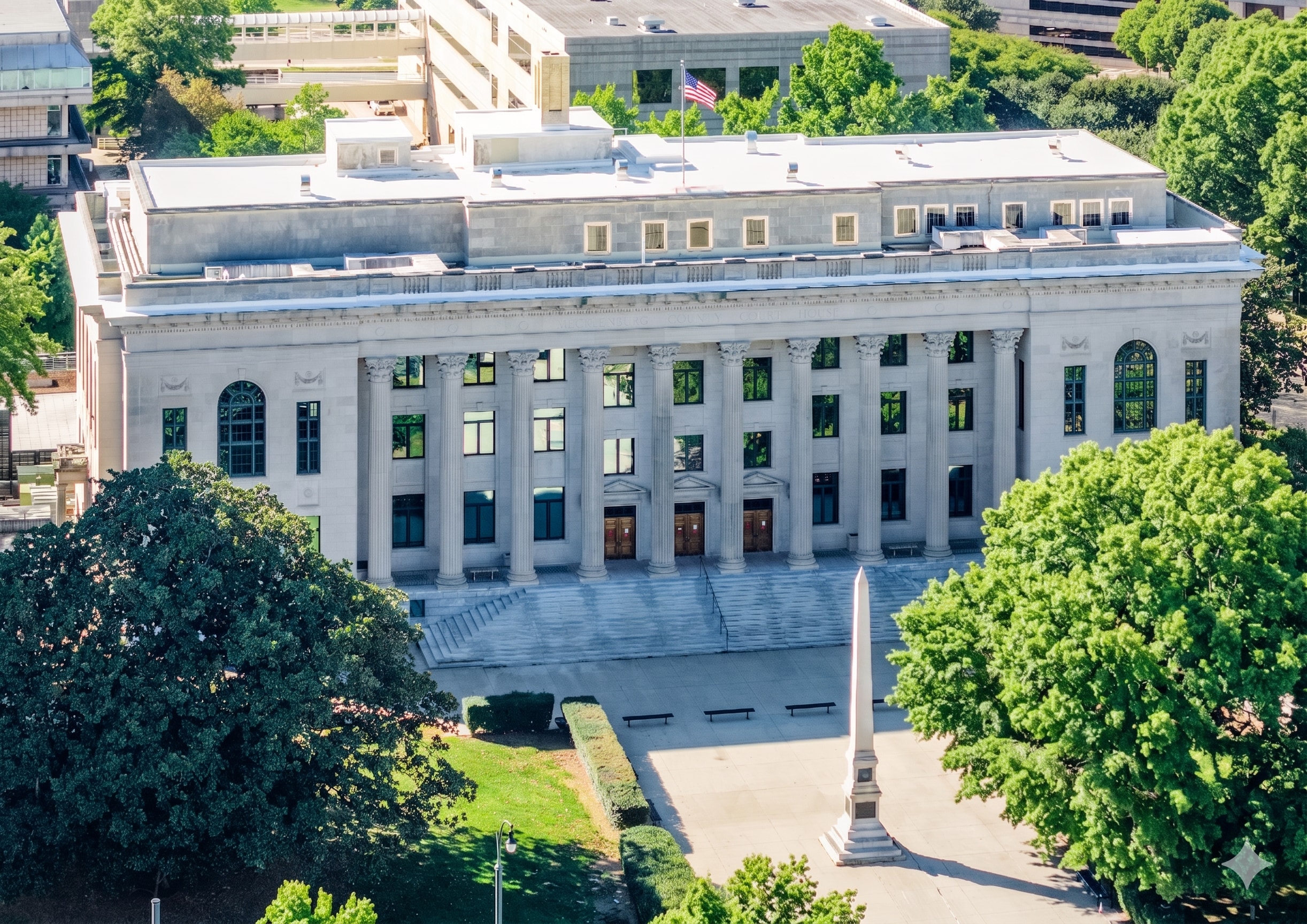 Aerial view of the historic Mecklenburg County District Attorney’s Office featuring a commercial roof replacement with Siplast roofing materials.